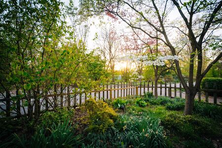 Fence and gardens at Cylburn Arboretum, in Baltimore, Maryland.の写真素材