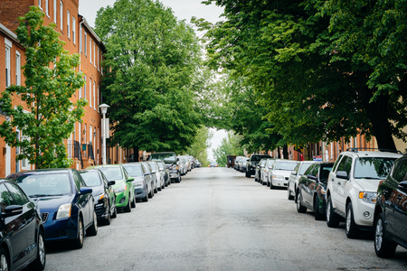 A tree-lined street in Federal Hill, Baltimore, Maryland.の写真素材