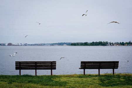 Benches on the waterfront in Canton, Baltimore, Maryland.の写真素材