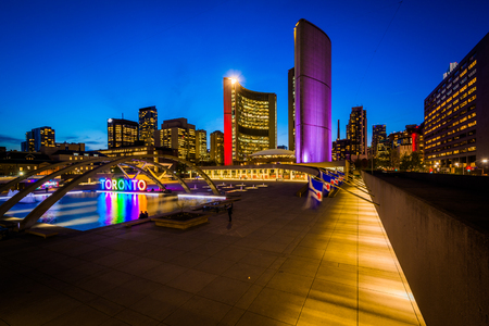 View of Nathan Phillips Square and Toronto Sign in downtown at night, in Toronto, Ontario.のeditorial素材