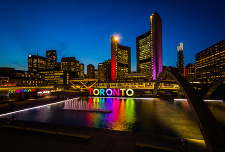 View of Nathan Phillips Square and Toronto Sign in downtown at night, in Toronto, Ontario.のeditorial素材