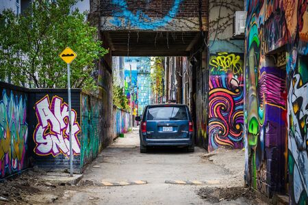 Colorful street art in Graffiti Alley, in the Fashion District of Toronto, Ontario.のeditorial素材