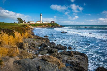 Rocky coast and view of Piegon Point Lighthouse in Pescadero, California.の写真素材