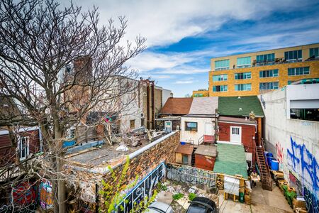 View of graffiti on buildings in the Kensington Market neighbourhood of Toronto, Ontario.