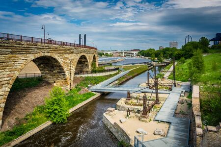 Ruins at Mill Ruins Park and the Stone Arch Bridge, in downtown Minneapolis, Minnesota.の写真素材