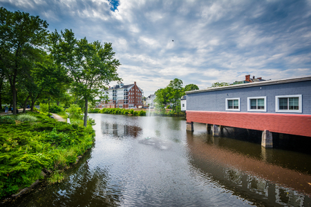 Buildings along the Cocheco River and fountain in downtown Dover, New Hampshire.の写真素材