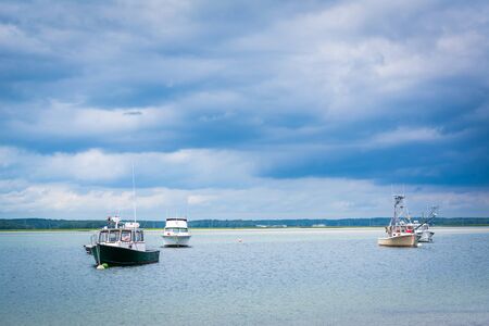 Boats in Hampton Harbor, in Hampton Beach, New Hampshire.の写真素材