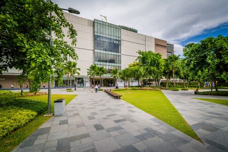 Walkway at a park and skyscrapers at Bonifacio Global City, in Taguig, Metro Manila, The Philippines.のeditorial素材