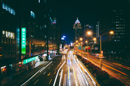 Modern buildings and street at night, in the Xinyi District, Taipei, Taiwan.のeditorial素材