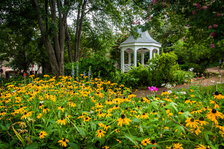 Colorful garden and gazebo in a park in Alexandria, Virginia.の写真素材