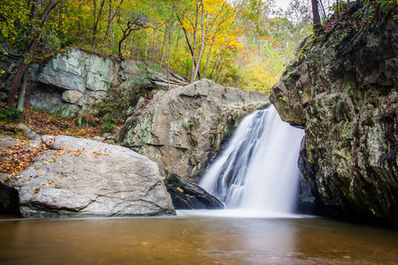 Early autumn color and Kilgore Falls, at Rocks State Park, Maryland.の写真素材