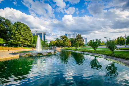 Fountain and lake at Marshall Park, in Uptown Charlotte, North Carolina.の写真素材
