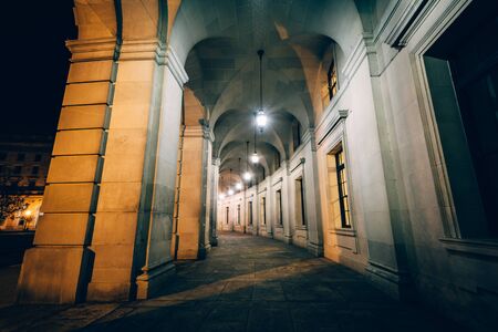Exterior corridor of the Ronald Reagan Building and International Trade Center at night, in Washington, DC.のeditorial素材