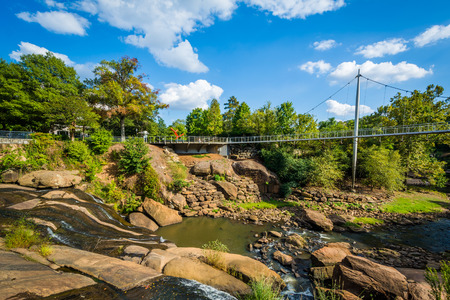 Bridge and waterfall at the Falls Park on the Reedy, in Greenville, South Carolina.の写真素材