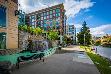 Modern buildings and walkway along the Reedy River, in downtown Greenville, South Carolina.の写真素材