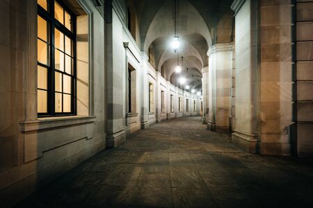 Exterior corridor of the Ronald Reagan Building and International Trade Center at night, in Washington, DC.の写真素材