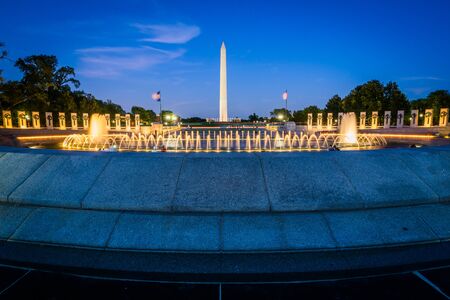 Fountains at the National World War II Memorial and the Washington Monument at night, at the National Mall, in Washington, DC.のeditorial素材