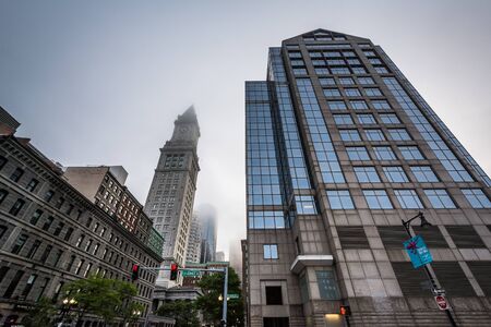 Modern building and the Custom House Tower, in Boston, Massachusetts.