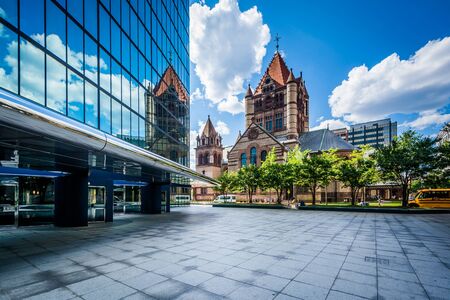 The John Hancock Tower and Trinity Church, at Copley Square, in Back Bay, Boston, Massachusetts.の写真素材