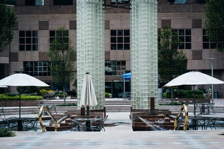 Park with fountain and tables in Uptown Charlotte, North Carolina.