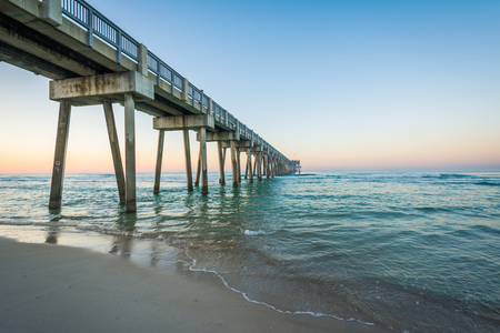 The M.B. Miller County Pier and Gulf of Mexico at sunrise, in Panama City Beach, Florida.の写真素材