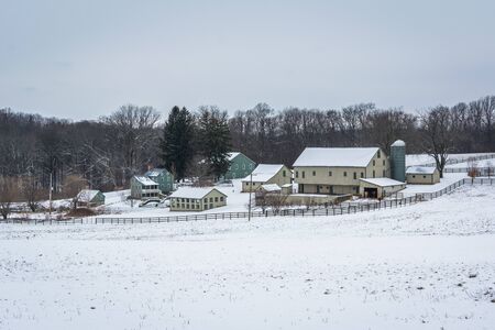 View of a snow covered farm near New Freedom, Pennsylvania.の写真素材