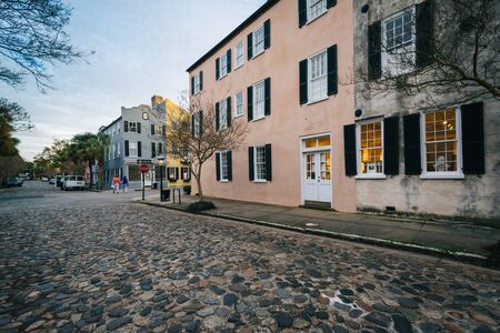 Cobblestone street and old buildings in Charleston, South Carolina.の写真素材