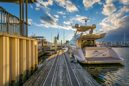 Boats in a marina on the Canton Waterfront, in Baltimore, Maryland.の写真素材
