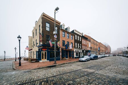Thames Street, a cobblestone street in Fells Point, Baltimore, Maryland.のeditorial素材