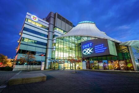The Institute of Marine and Enviromental Technology at night, at the Inner Harbor in Baltimore, Maryland.のeditorial素材
