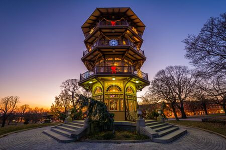 Christmas decorations on the Patterson Park Pagoda at sunset, in Baltimore, Maryland.のeditorial素材