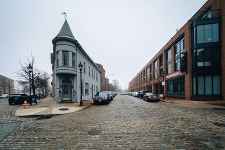 Cobblestone streets and historic buildings in Fells Point, Baltimore, Maryland.のeditorial素材