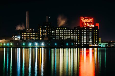 The Domino Sugars Factory at night, in Baltimore, Maryland.のeditorial素材
