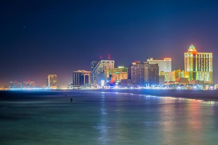 The skyline and Atlantic Ocean at night, in Atlantic City, New Jersey.の写真素材