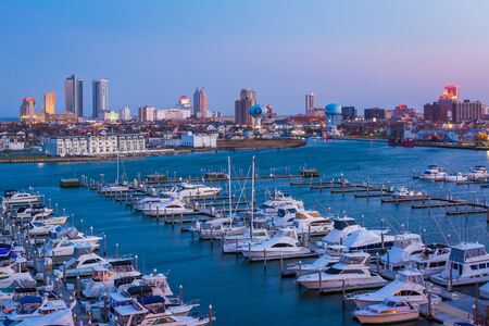 View of the Farley State Marina and skyline at night, in Atlantic City, New Jersey.の写真素材