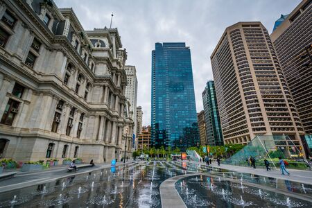 Fountains at Dilworth Park and modern building in the Center City of Philadelphia, Pennsylvania.