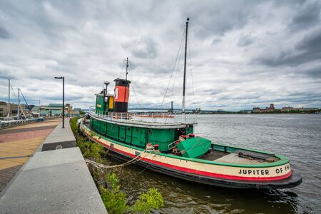 A tugboat docked on the Delaware River, at Penn's Landing, in Philadelphia, Pennsylvania.
