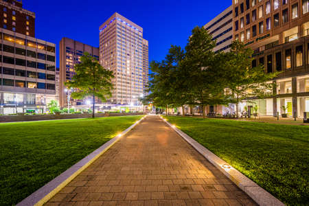 Walkway and buildings at Center Plaza at night, in downtown Baltimore, Maryland.の写真素材