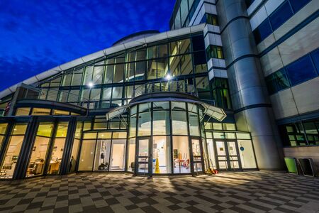 The Institute of Marine and Environmental Technology at night, at the Inner Harbor in Baltimore, Maryland.のeditorial素材