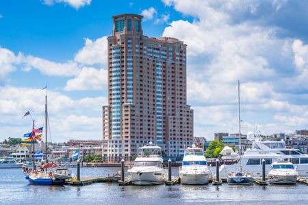 View of a marina and buildings at the Inner Harbor in Baltimore, Maryland.のeditorial素材