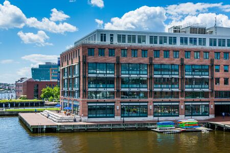 View of buildings along the waterfront in Fells Point, Baltimore, Maryland.の写真素材