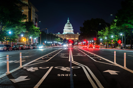 Bike lanes on Pennsylvania Avenue and the United States Capitol at night, in Washington, DC.のeditorial素材