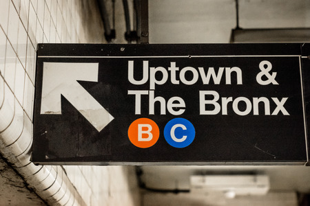 Uptown and The Bronx sign in a subway station in Manhattan, New York Cityの写真素材