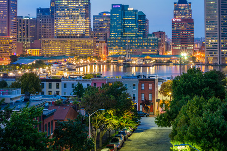 View of Federal Hill row houses and the Inner Harbor at night, in Baltimore, Marylandのeditorial素材