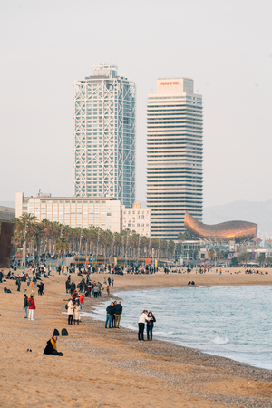 The beach at La Barceloneta and skyscrapers, in Barcelona, Spainの写真素材