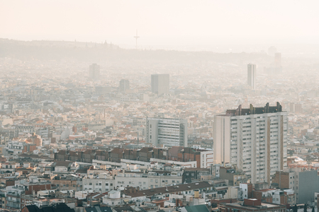 Hazy cityscape view from Bunkers del Carmel, in Barcelona, Spainの写真素材