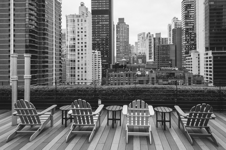 Chairs on a rooftop and view of Turtle Bay, in Midtown Manhattan, New York Cityの写真素材