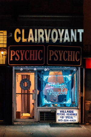 Psychic neon sign at night, in the East Village, Manhattan, New York Cityのeditorial素材
