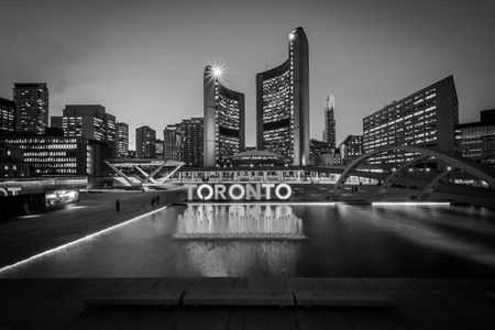 View of Nathan Phillips Square and Toronto Sign in downtown at night, in Toronto, Ontario.のeditorial素材