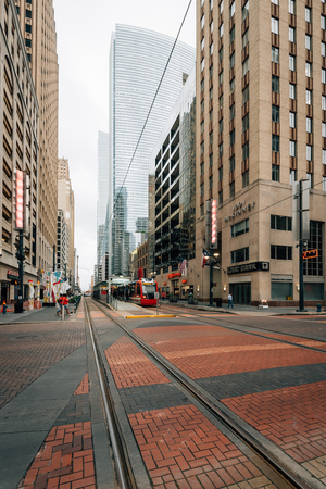 Modern buildings and light rail tracks along Main Street, in Houston, Texas